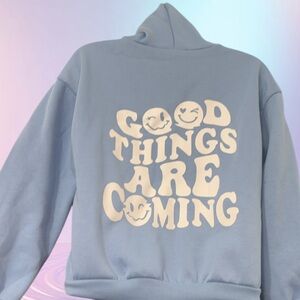 Light blue “good things are coming” kids sweater size 10/12 great condition